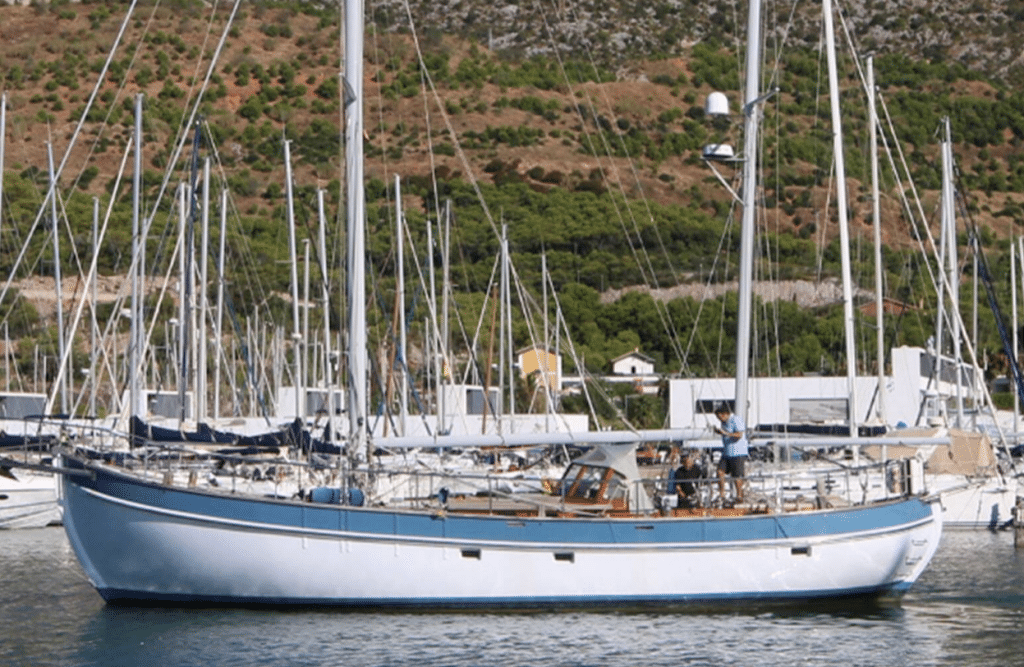 Sailing Ketch being moved in Port Ginesta