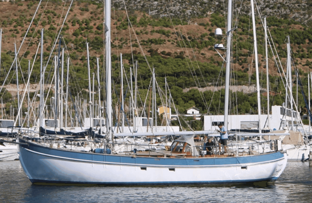 Sailing Ketch being moved in Port Ginesta