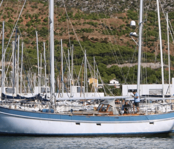 Sailing Ketch being moved in Port Ginesta